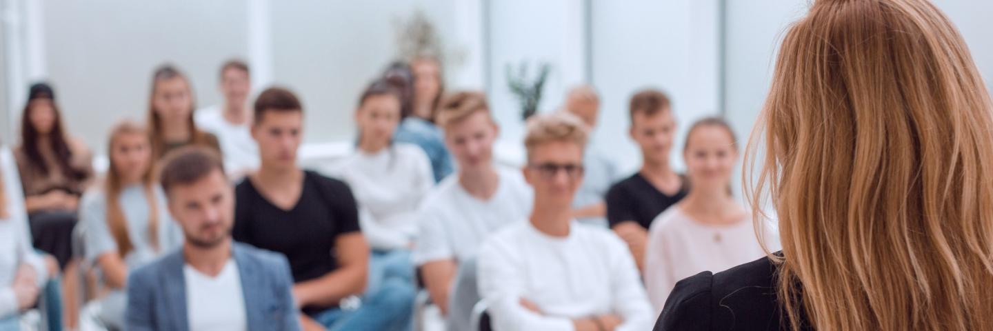 Female Speaker talking to a group of people