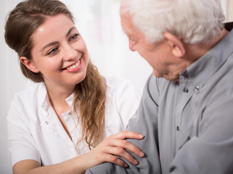 Female nurse with elderly man