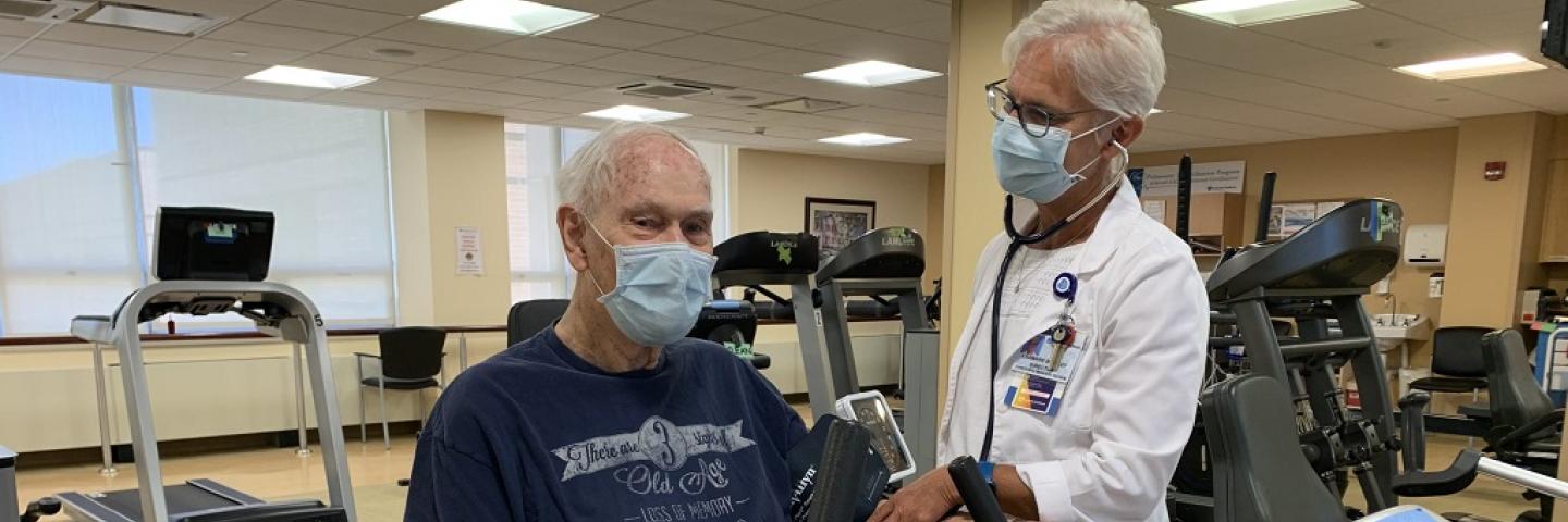 Patient getting blood pressure check in cardiac rehab 