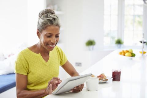 Person on a tablet reading